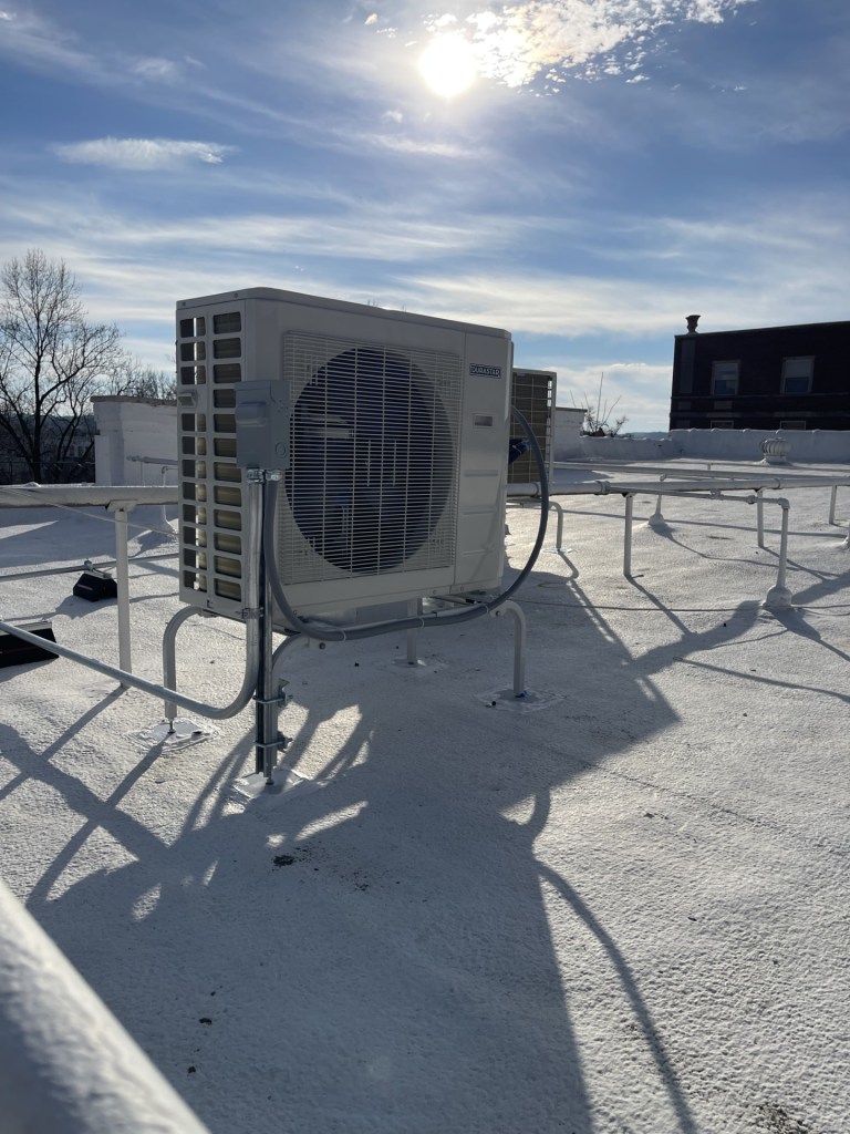 Pierce LLC installing rooftop AC unit in Lancaster, OH